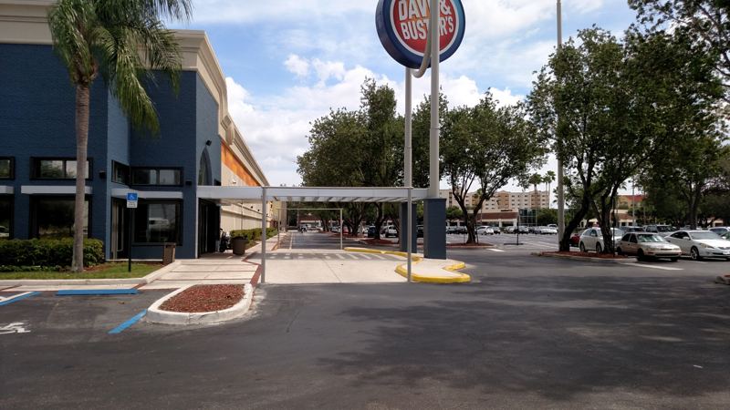Metal covered walkway outside a restaurant entrance